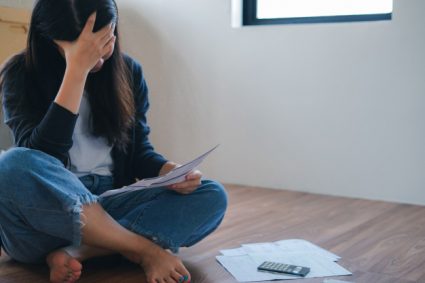 money-saving for young adults: stressed woman