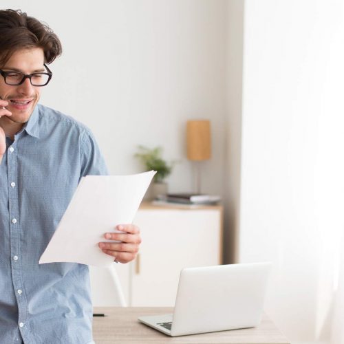 A young man calls the bank about debt consolidation with Halifax