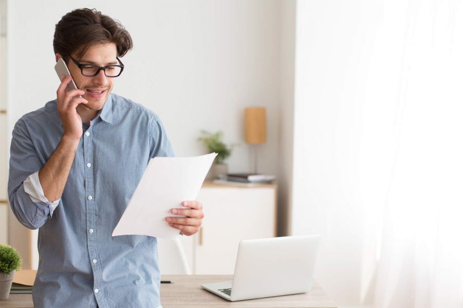 A young man calls the bank about debt consolidation with Halifax