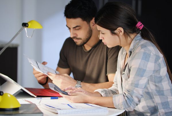Debt Consolidation Loan: Is It Suitable for You? | DCL Man and woman worried about debts and thinking about a debt management plan