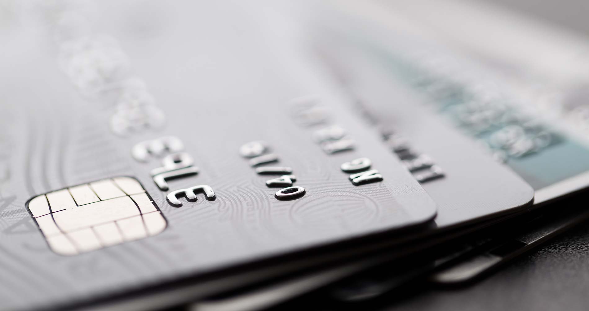 A stack of credit cards, which are classed as bad debt