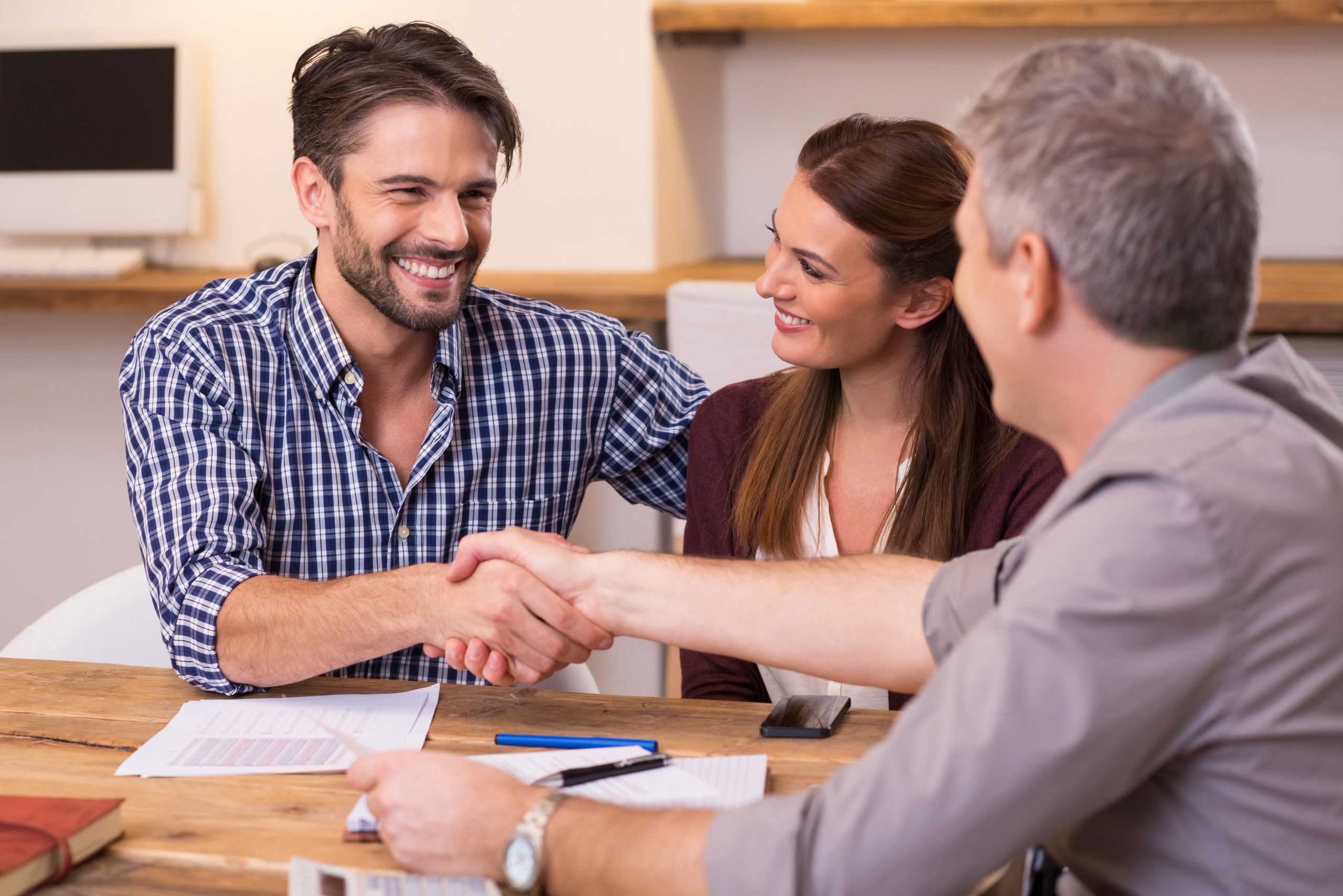 A young couple sign an agreement for a debt relief order